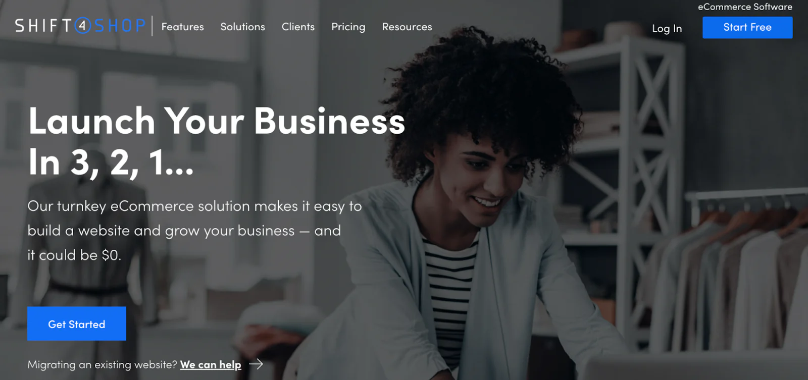 Shift4Shop homepage promoting ecommerce website solutions and showing a smiling person using a laptop.