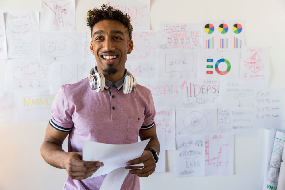 Man standing in front of a white board