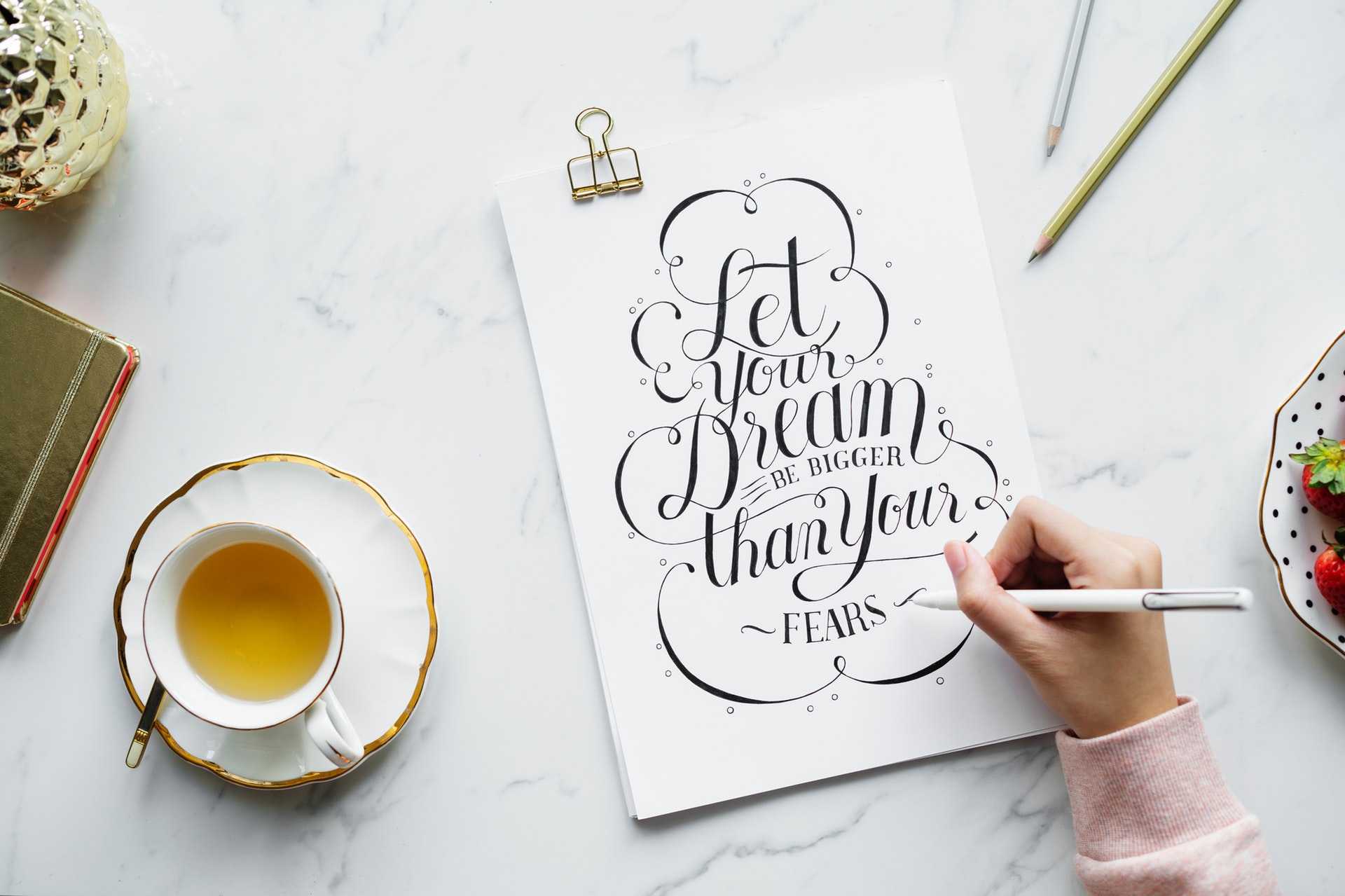 How to get a career in graphic design: Hand drawing ornate letters onto paper