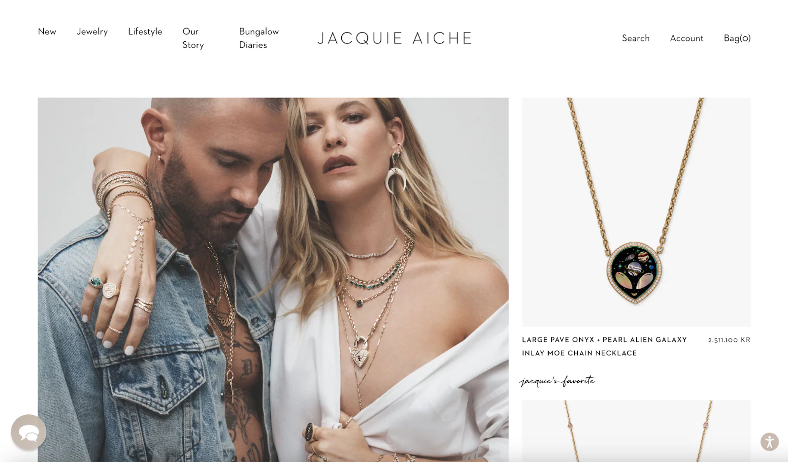 Two people embrace, adorned in bohemian-style jewelry.