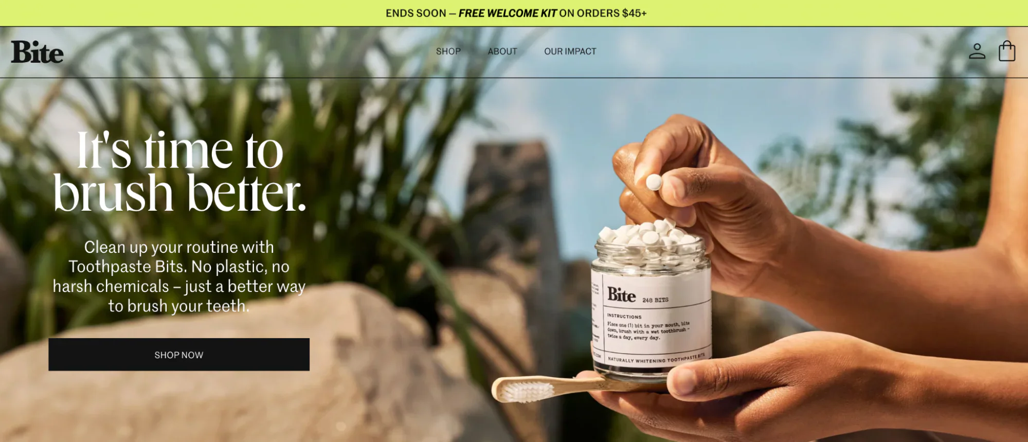 Bite Toothpaste’s home page with a close-up of someone taking a toothpaste bit from a glass jar.