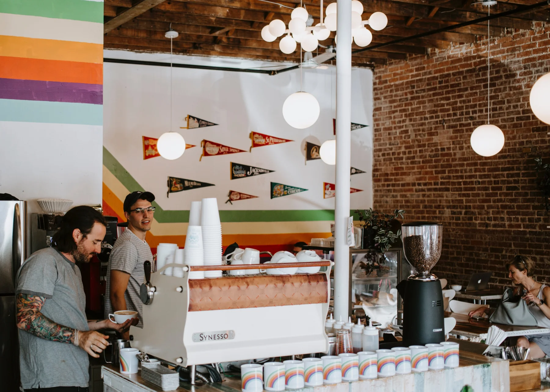 Two people working inside an independent cafe