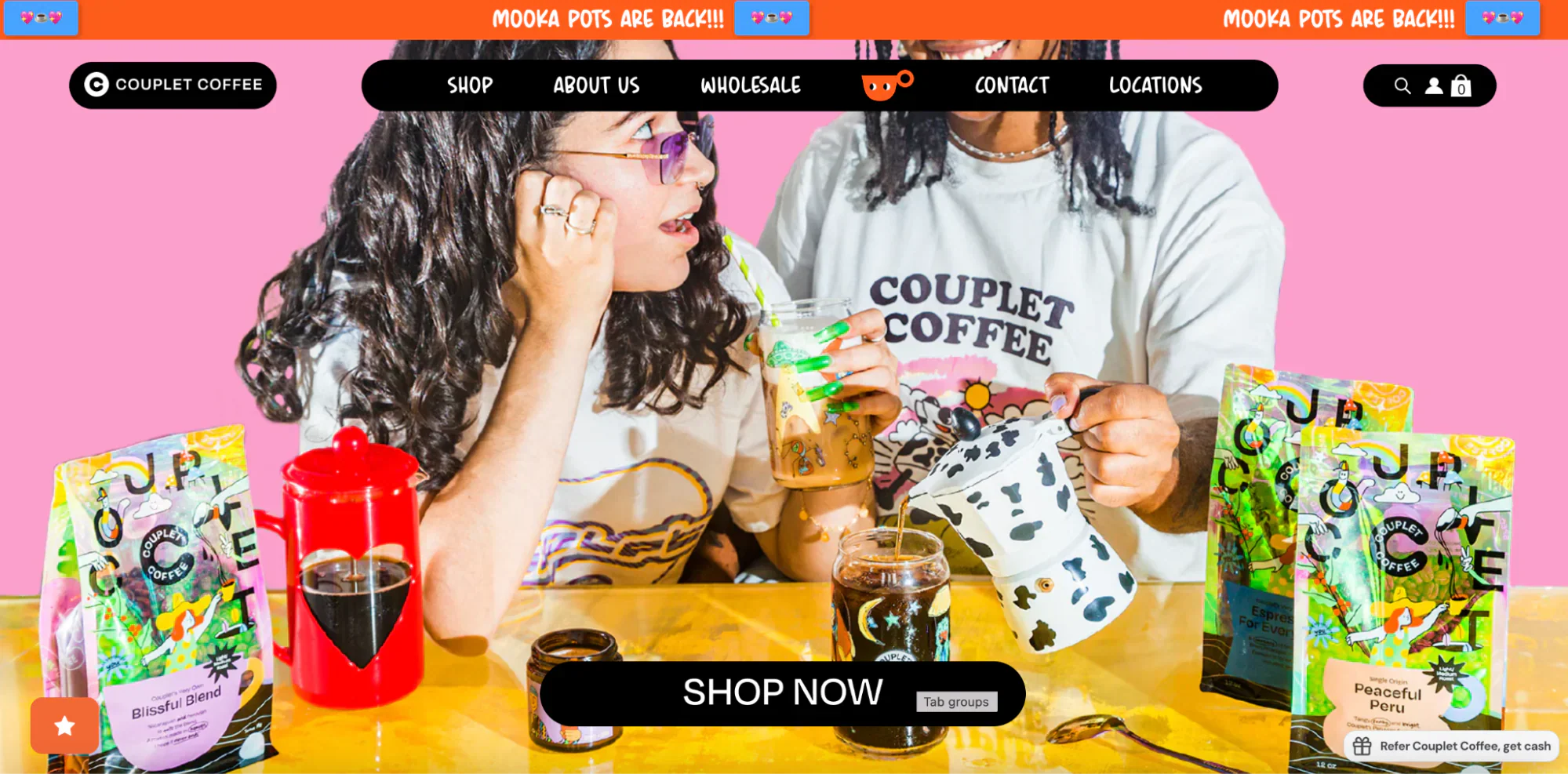 Couplet Coffee’s homepage shows two people talking and making coffee.