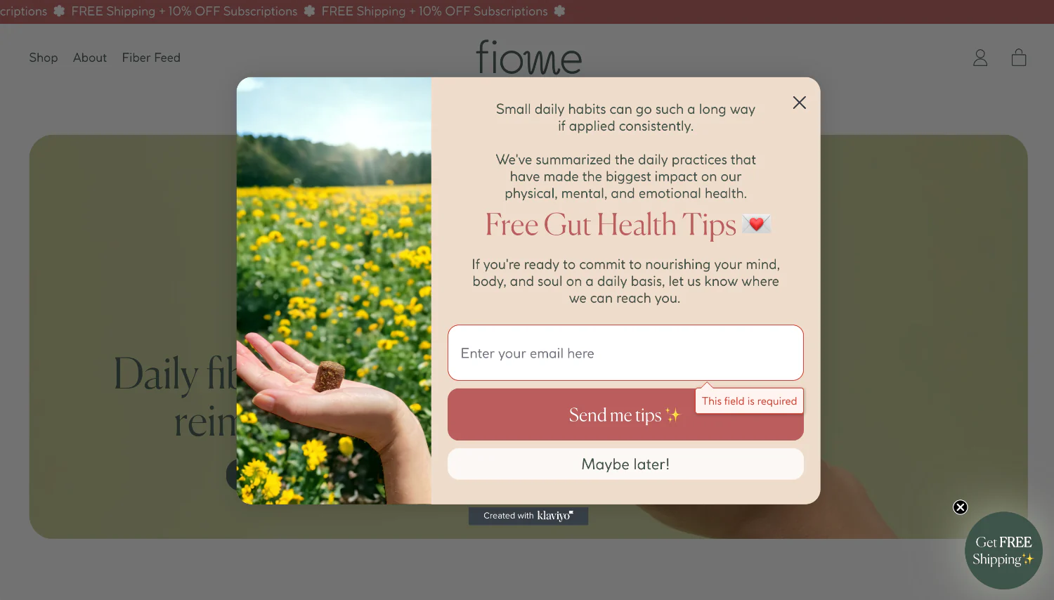 A pop-up with a hand holding a fiber bite over a flower field with a signup for gut health tips.