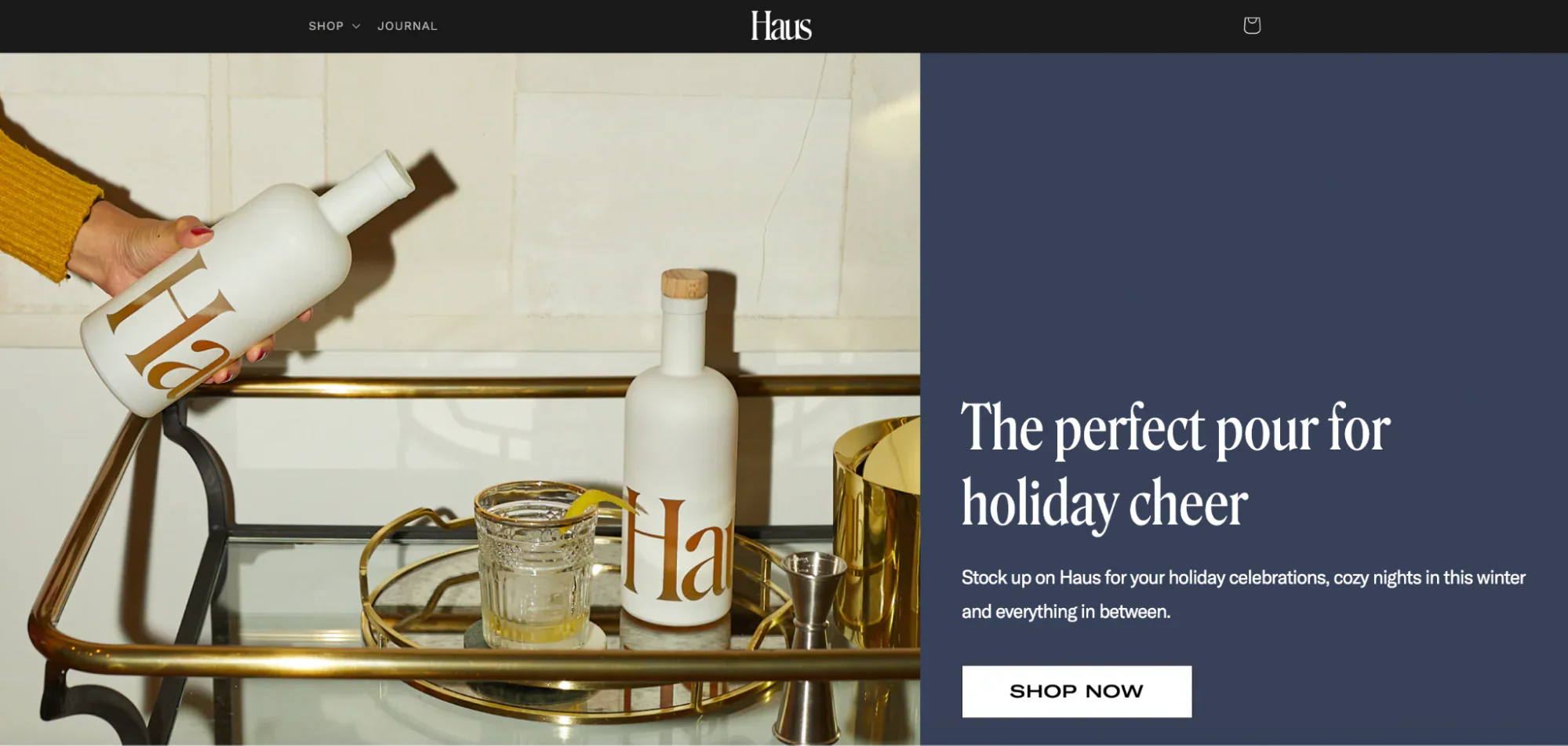 Haus’ homepage with a hand holding a bottle over a drinks trolley.