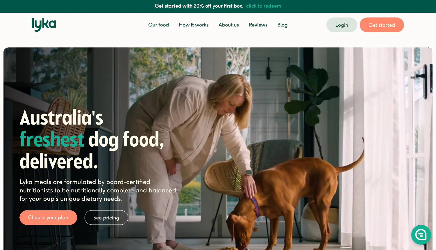 Lyka homepage featuring a woman feeding a brown dog fresh food.