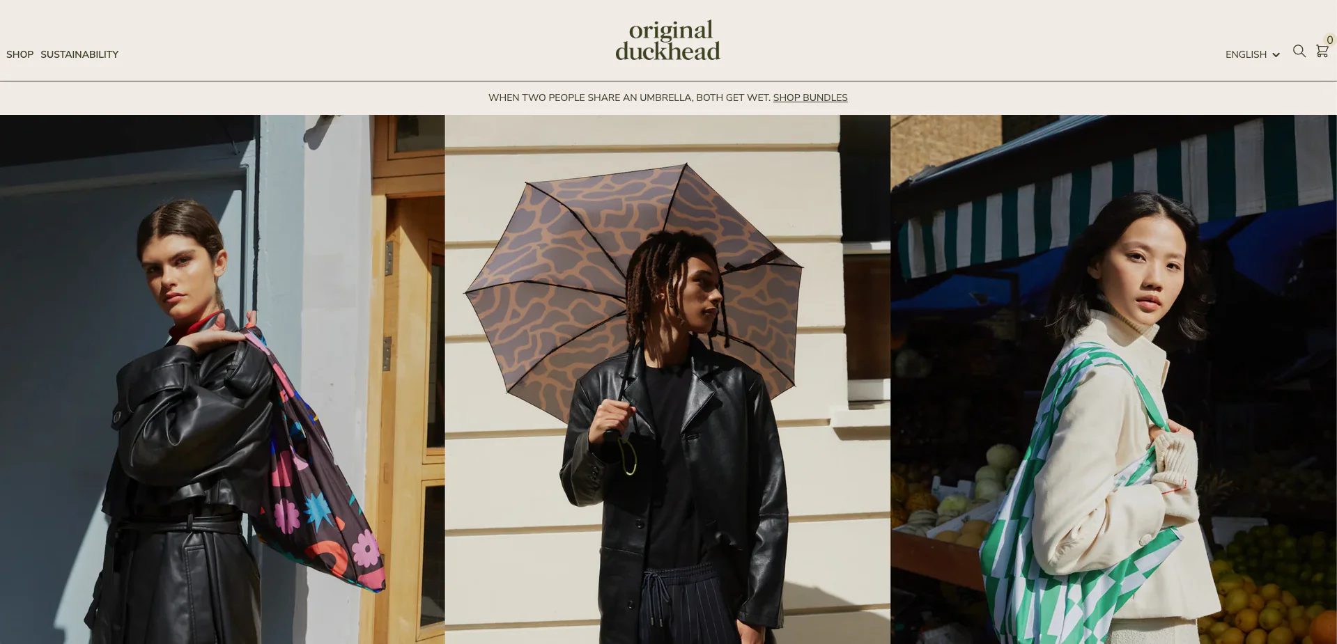 Three stylish models showcasing Original Duckhead patterned umbrellas and tote bags.