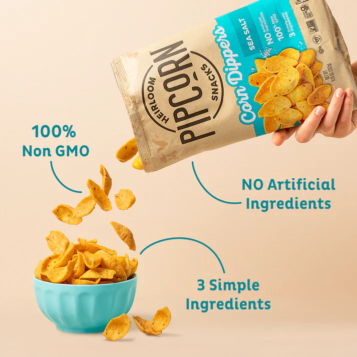 A person pours a bag of Pipcorn corn dippers into a blue bowl, next to the text 100% non GMO, NO artificial flavors, and 3 simple ingredients