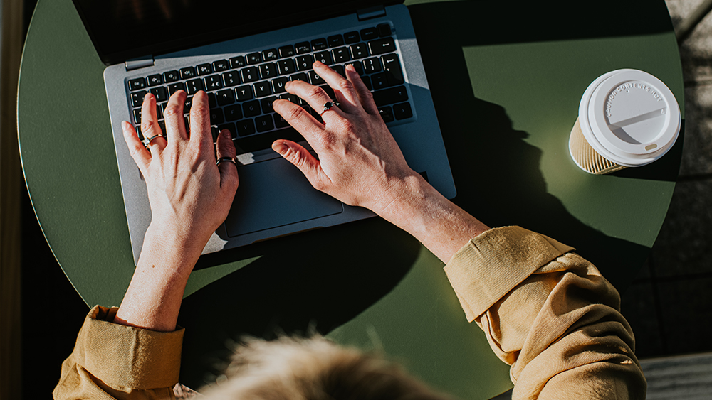 An image of a freelance creative working on a laptop