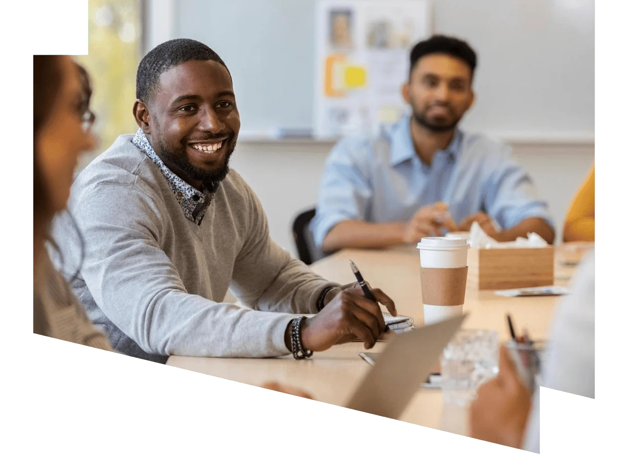 People in meeting smiling