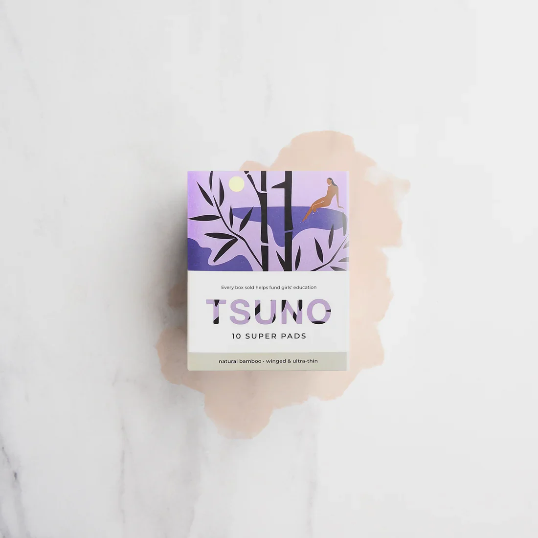 A pack of 10 Tsuno super pads with a purple illustration of a woman laying next to a pool of water