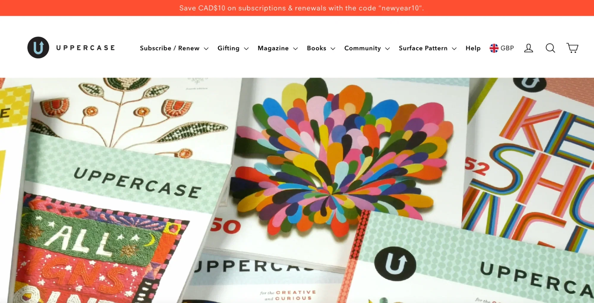 UPPERCASE magazine’s homepage is bright and bold, showing a pile of books.