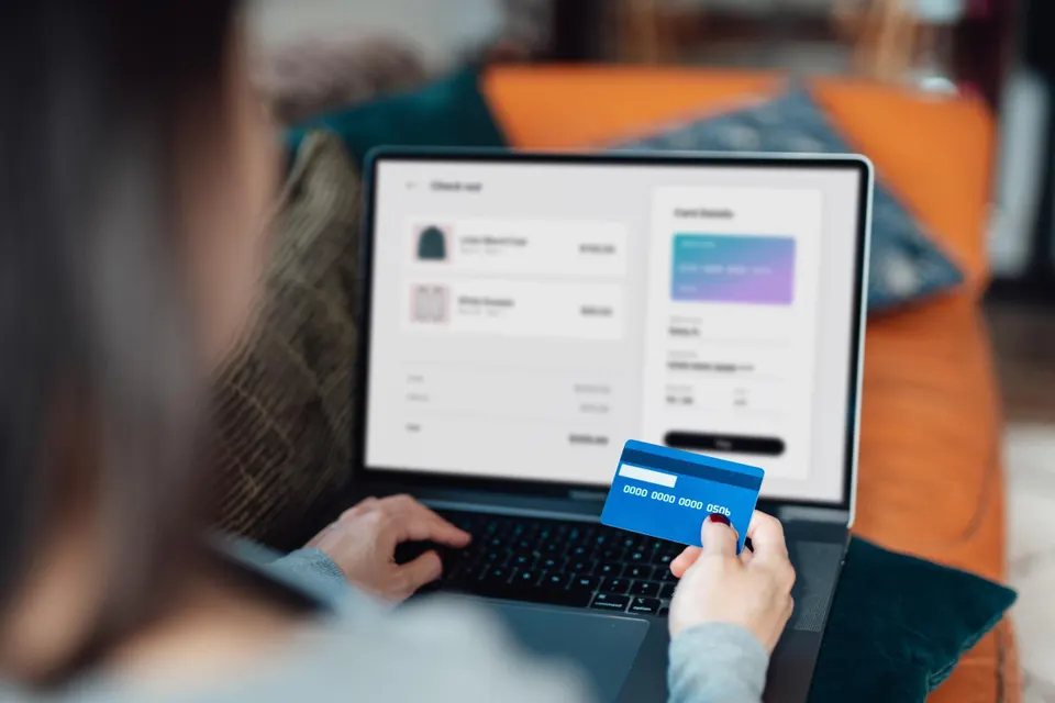 Woman using credit card for online shopping