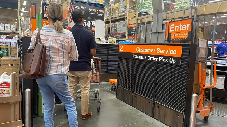People waiting in line to pick up orders at Home Depot