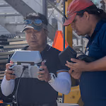 Naval Information Warfare Center technicians operate a drone during a demonstration at Pearl Harbor Naval Shipyard & Intermediate Maintenance Facility, Hawaii, June 18, 2025. The demonstration was part of a collaborative project between Pearl Harbor Naval Shipyard & Intermediate Maintenance Facility and Naval Information Warfare Center Pacific to explore drone-assisted maintenance, inspection, and emergency response capabilities. PHNSY & IMF's mission is to keep the Navy's fleet 