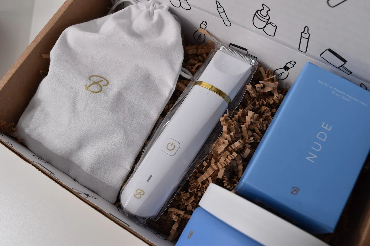 A box of Bushbalm goods, including a razor and a tub of cream.