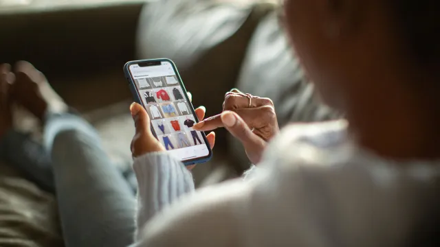 Woman purchasing clothes on a mobile app