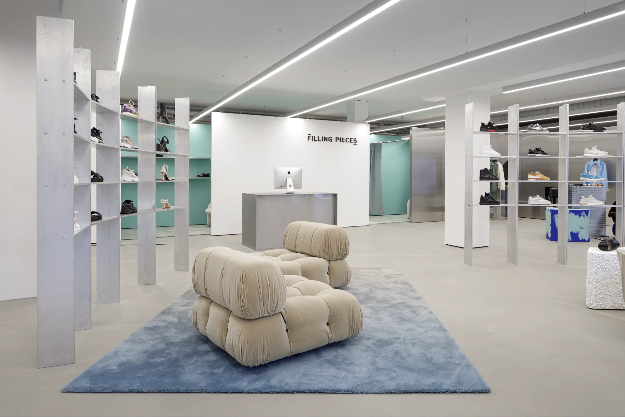 Image of a Filling Pieces store with two couches and shoes