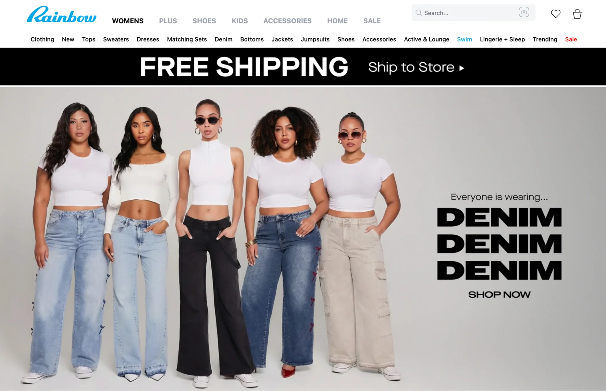 Five women in white tops and denim jeans with Everyone is wearing Denim Denim Denim slogan.