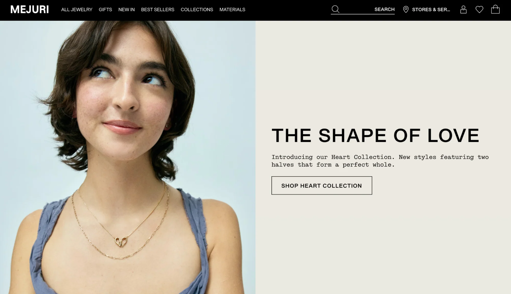 Woman wearing gold heart necklaces for the Mejuri Shape of Love Heart Collection campaign launch.